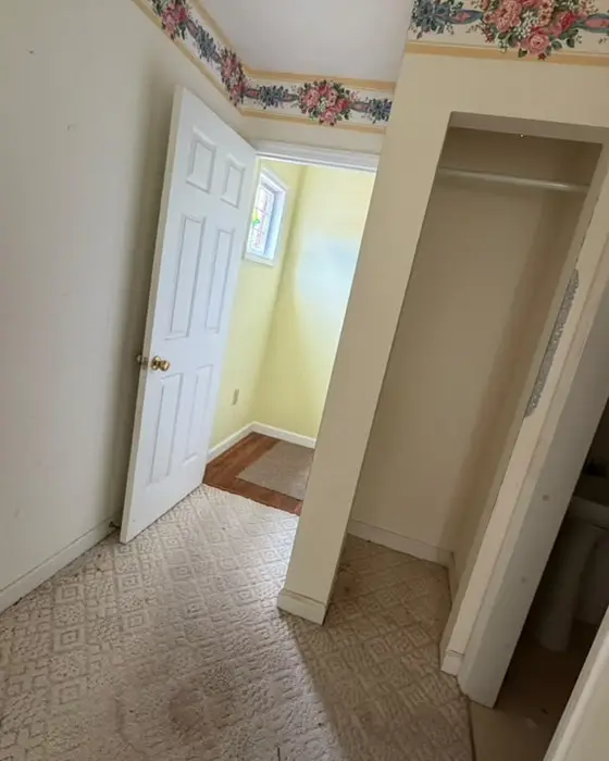 Hallway with a stained carpet