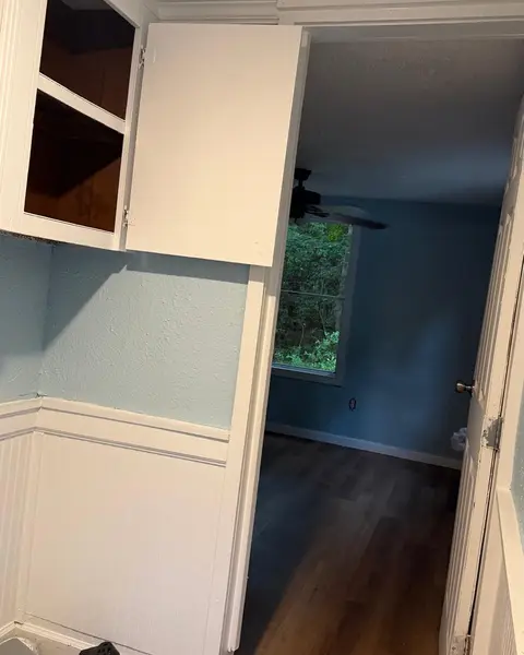 Freshly cleaned white cabinets and hallway