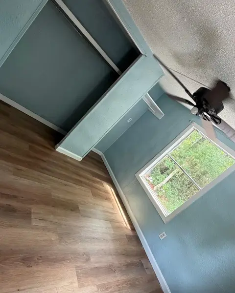 Empty room with a closet and window