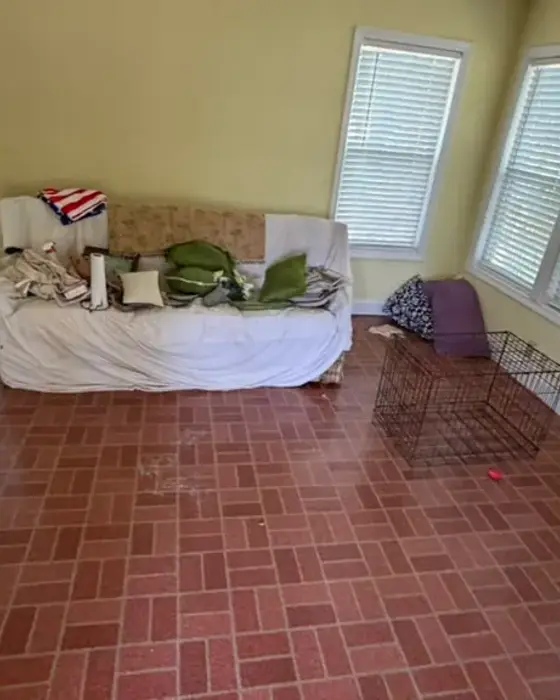 Before: living room crowded with furniture and clutter